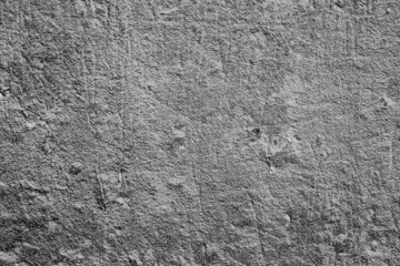Texture of a concrete wall with cracks and scratches which can be used as a background