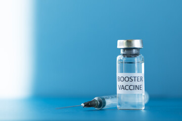 booster vaccine of coronavirus and a medical syringe,third stage of vaccination