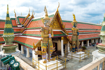 Naklejka premium Grand Palace, Bangkok, Thailand, November 2017 - view of the Giants statues in the palace's complex