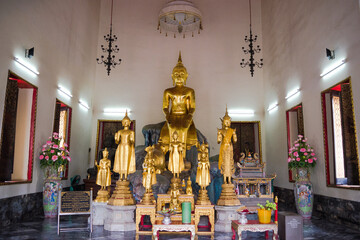 Bangkok, Thaiand, November 2017 - view of golden buddha statues in a shrine at Wat Pho