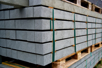 Pile of square posts made from recycled plastic waste