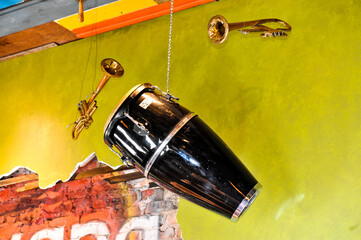 Colorful room with musical instruments hanging from the ceiling