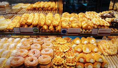 Various Kinds of Freshly Baked Bread and Donuts at Retailed Bakery Display