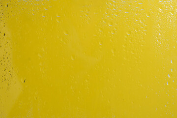 Yellow backgrond with water drops.