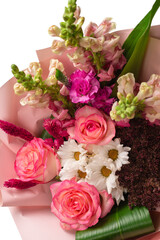 Bouquet of  soft pink flowers in pink wrapping paper.