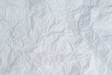 Crumpled white paper background.