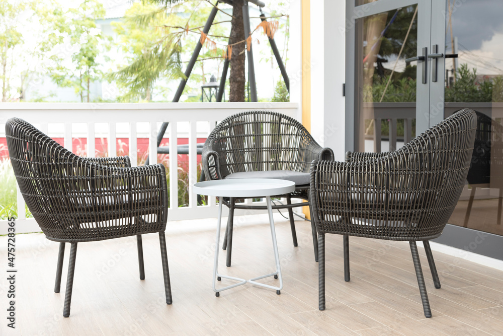 Sticker Three Wicker chairs and table on the outdoor terrace