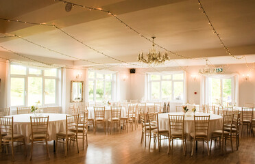 Reception and interiors of a beautiful British wedding in Romsey, Hampshire, UK.