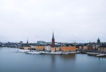 Fototapeta na wymiar Riddarholmen island in the winter snow, central Stockholm, Sweden.