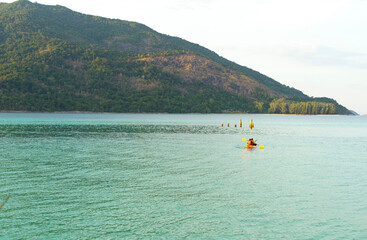 People kayaking in the sea at Ko Lipe island, Tarutao National Park, Satun, Thailand.