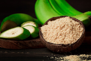 Green banana flour, on a wooden table, healthy food, selective focus, rustic style, horizontal, no people, © Gala_Didebashvili