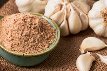 Spice ground garlic, rustic style, on a wooden table, close-up, no people, selective focus,