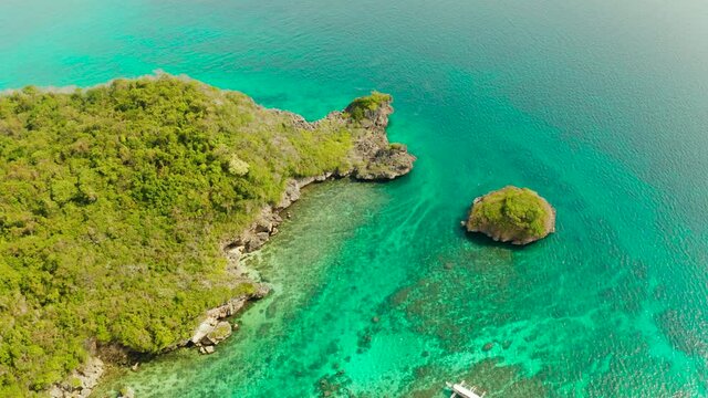 Turquoise lagoon with rocky island and corall reef, aerial view Boracay, Philippines. Summer and travel vacation concept.