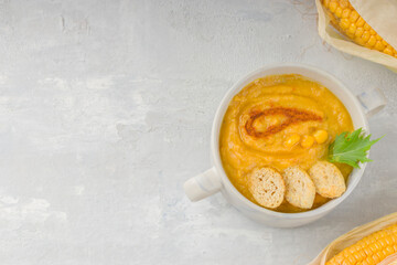 Food for vegans and vegetarians. Delicious creamy corn soup on a light background. Healthy diet. Copy space