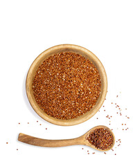 Red quinoa in wooden bowl, overhead image with white background