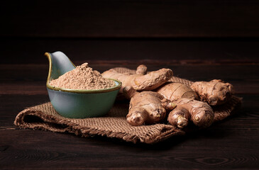 Ground and fresh ginger root, on a wooden table, rustic style, selective focus, no people,