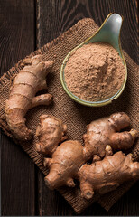 Ground and fresh ginger root, on a wooden table, rustic style, selective focus, no people,