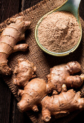 Ground and fresh ginger root, on a wooden table, rustic style, selective focus, no people,
