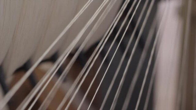 White yarn spinning on a wheel