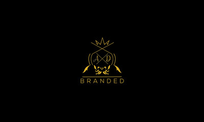 AD is a branded luxury logo with golden color and black background.