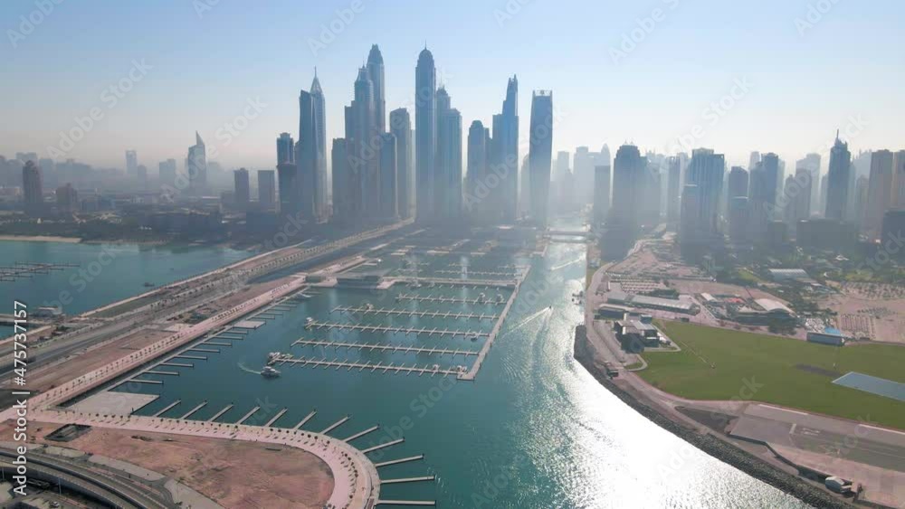 Wall mural new dubai harbour with marina skyscrapers rising above jbr beach with luxury buildings and resorts