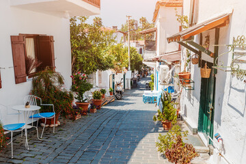 Fototapeta na wymiar Narrow romantic streets of the resort and tourist town of Kas with Greek-style whitewashed houses