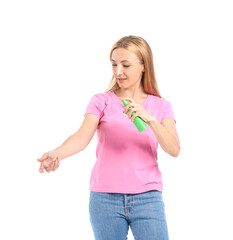 Mature woman with mosquito repellent on white background