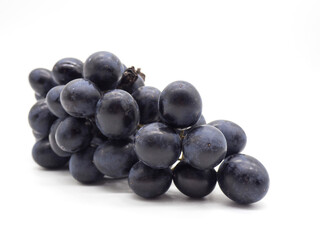 Bunch of black grapes isolated on white background