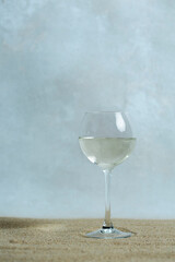 Minimalistic look of champagne flute on the sand stylish minimalistic look of champagne flutes on the sand on the eve of the holiday
