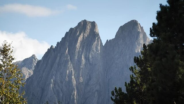 Rocky mountain peaks in Aiguestortes National Park, Catalonia, Spain.
Parallax camera movement, low angle, hd.