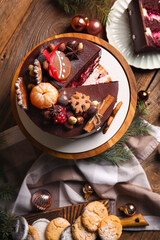 Composition with tasty Christmas chocolate cake on wooden background