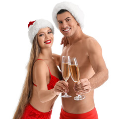 Sexy young couple in underwear and Santa hats drinking champagne on white background