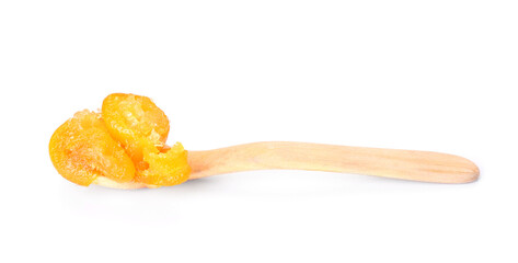 Spoon with tasty kumquat jam on white background