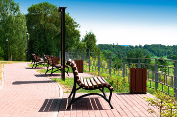 City park with benches on the embankment. Europe, Russia, Rzhev.