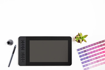 Modern designer workspace with graphic tablet, monitor, keyboard, succulent plant on white background. View from above. Flat style. Copy space.