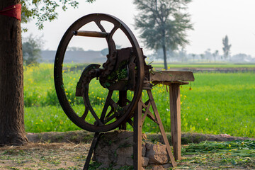Antique hand powered chopper machine in the countryside of Punjab