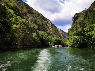 
Lake in the Matka canyon - Macedonia. Mountains, emerald water, motor boats. Landscape without people
