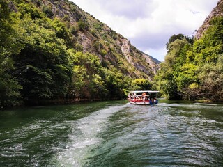 
Lake in the Matka canyon - Macedonia. Mountains, emerald water, motor boats. Landscape without...