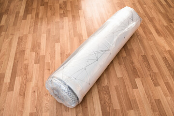 A new latex mattress, they arrive vacuum rolled without air.