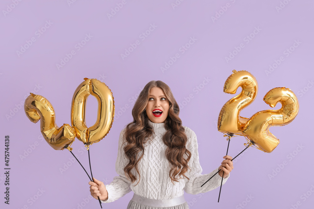 Sticker Beautiful young woman with balloons in shape of figure 2022 on color background