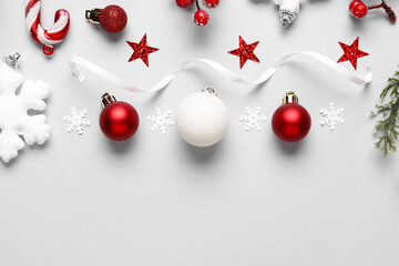 Beautiful Christmas composition with balls and ribbon on white background