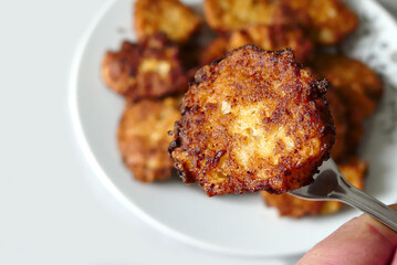 close-up pan fried cauliflower,fried cauliflower on a dinner fork,