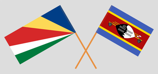 Crossed flags of Seychelles and Eswatini. Official colors. Correct proportion