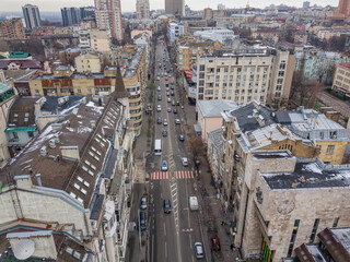 Fototapeta premium City street in Kiev in cloudy weather. Aerial drone view.