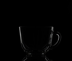 glass cup isolated on a black background