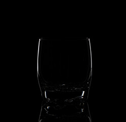 empty transparent water glass or wine and whiskey or brandy glasses, isolated on black background