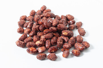 Some peanuts praline sweet on white table or background.
