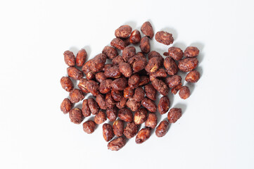 Top view of some peanuts praline sweet on white table or background.