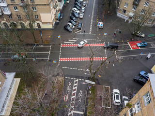 Obraz premium City street with a bike path in Kiev in cloudy weather. Aerial drone view.