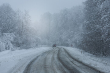 Fototapeta na wymiar Snowy and frozen mountain road in winter landscape. Uludag National Park. Bursa, Turkey. 